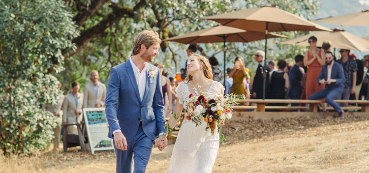 a laughing couple during their wedding at The Toll House at Bell Valley Retreat in Anderson Valley, Mendocino County, California