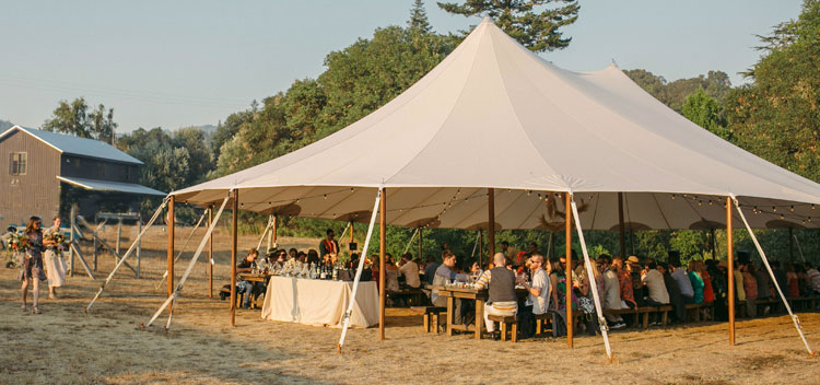 tent shelters wedding guests at dinner at Bell Valley Retreat