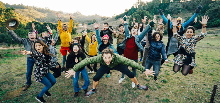 happy retreat-goers leap into the air