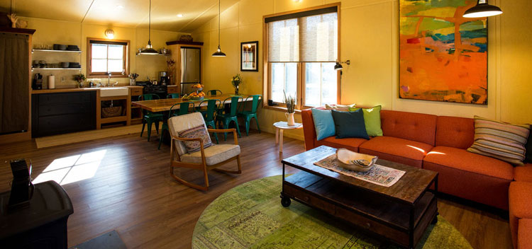 the barn living space with modern, colorful furnishings